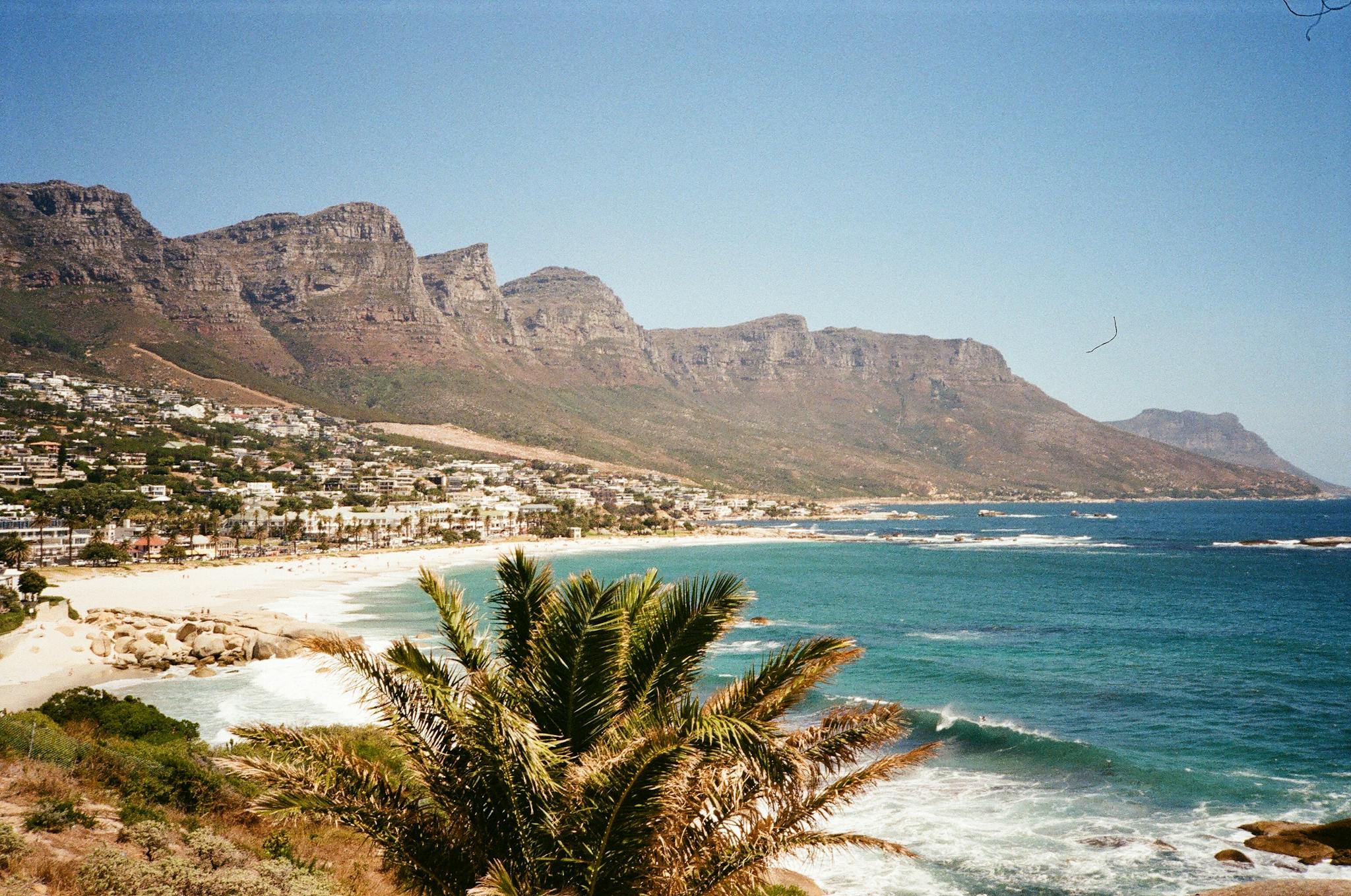 A breathtaking seaside view of Camps Bay and the Twelve Apostles mountains in Cape Town, South Africa.