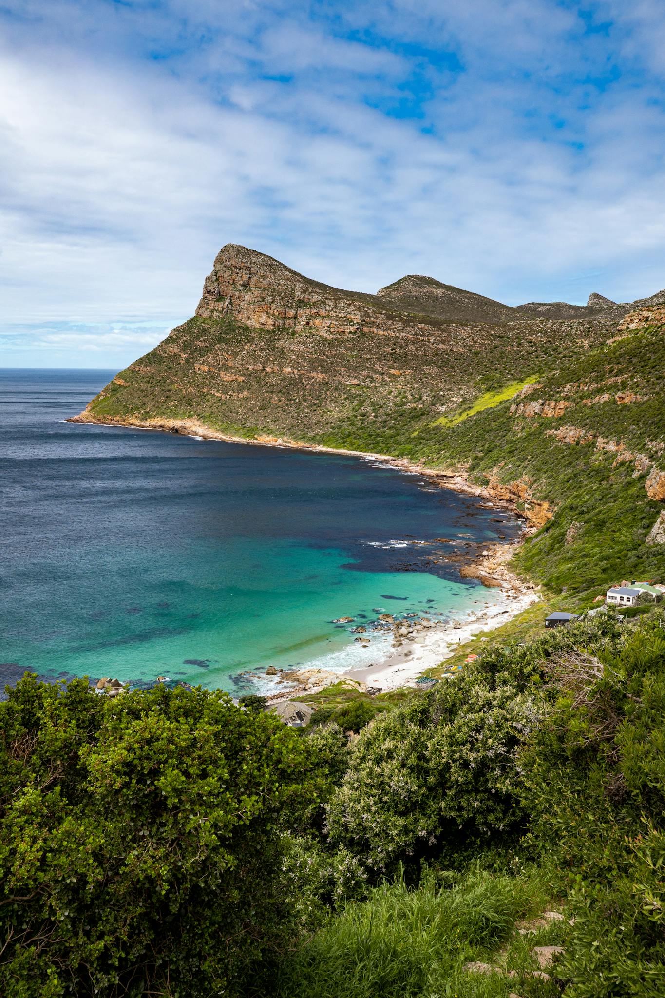 Stunning view of Cape Point with crystal clear turquoise waters and rugged cliffs.