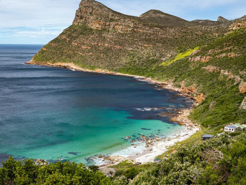 Stunning view of Cape Point with crystal clear turquoise waters and rugged cliffs.